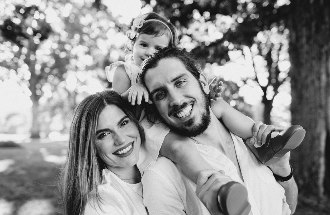 Josh and Rachael Lucas, the husband-and-wife team behind Lucas Studios NC, embracing outdoors
